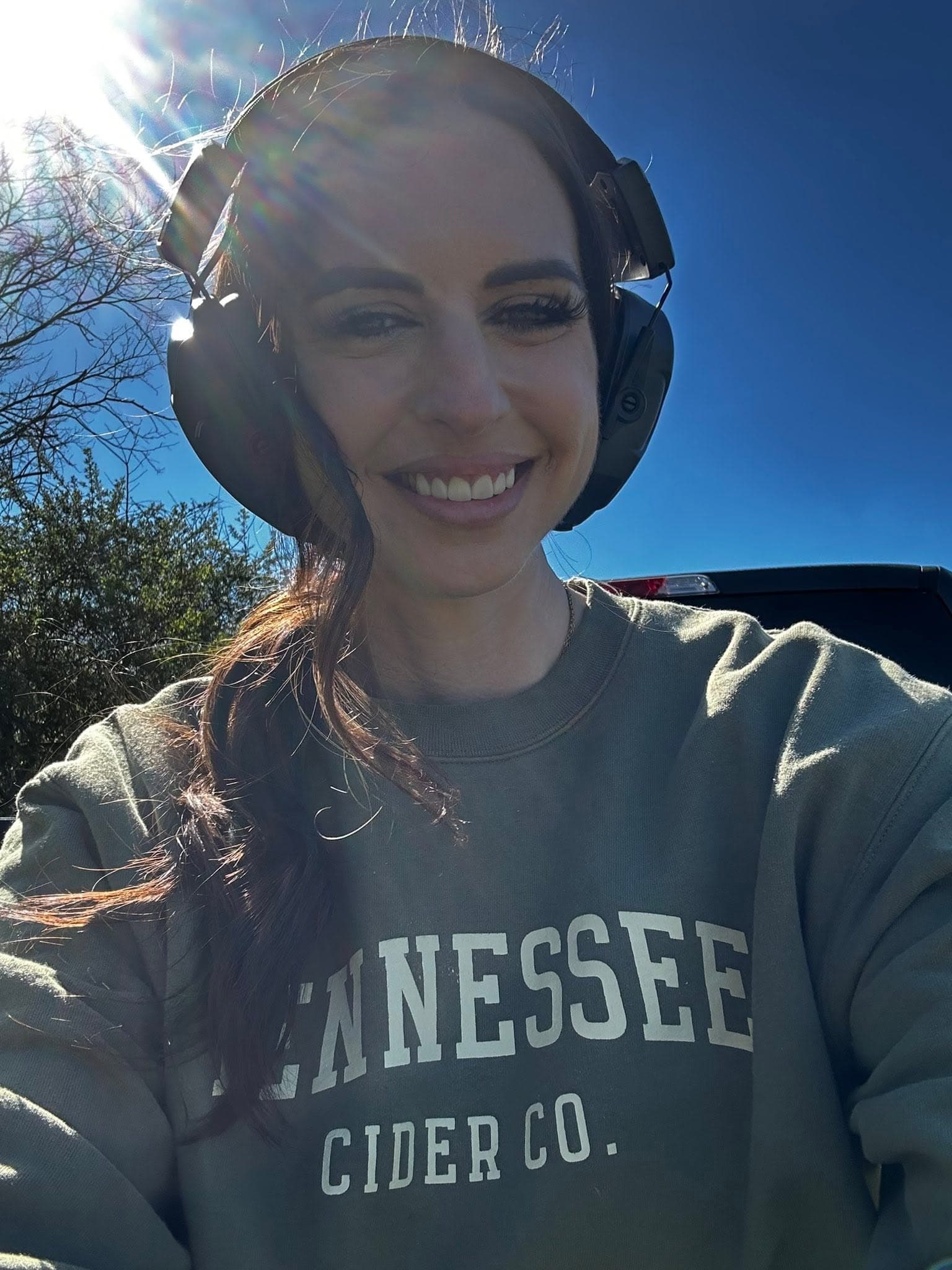 Mandy, wearing ear protection, at the range