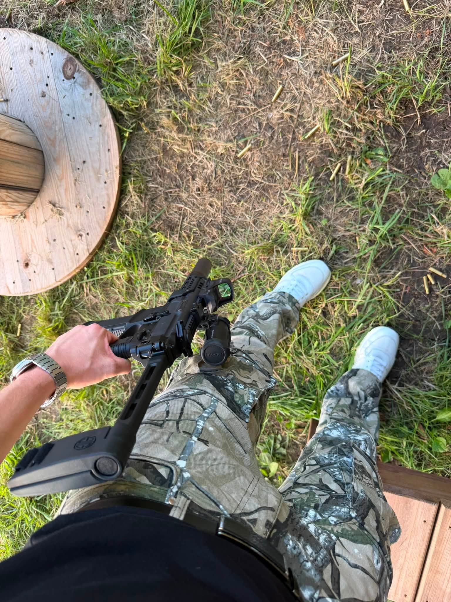 Adjusting a rifle stock at the shooting bench